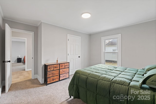 bedroom featuring crown molding and carpet flooring