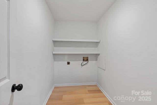 laundry room with electric dryer hookup, hookup for a washing machine, and wood-type flooring