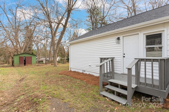 entrance to property featuring a lawn