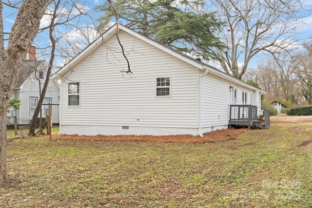 view of home's exterior with a lawn