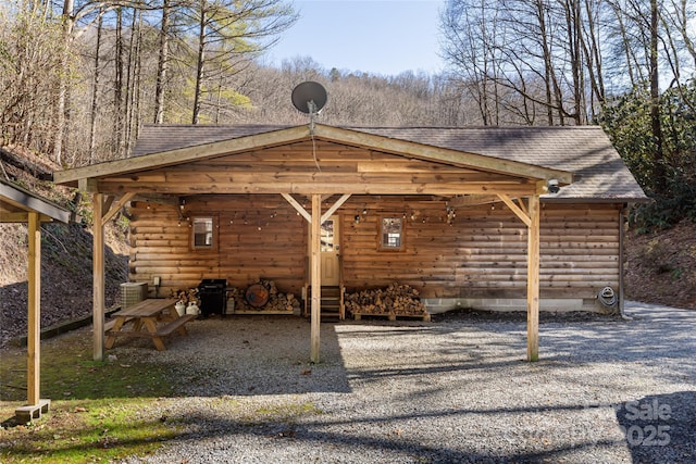 exterior space featuring driveway and a carport