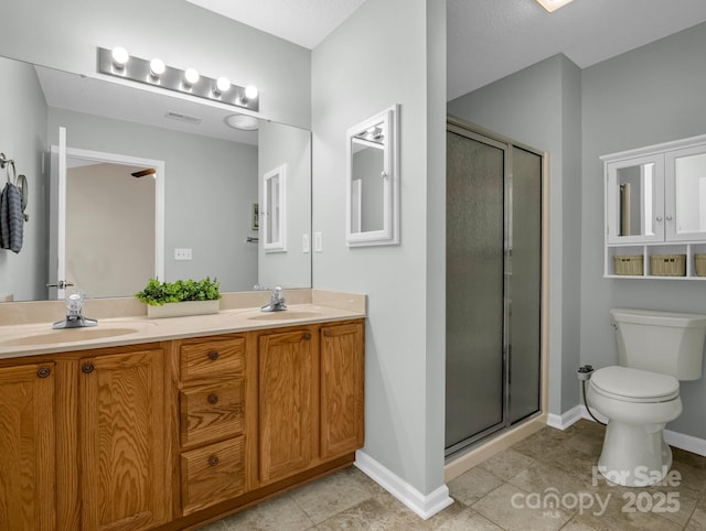 full bathroom with a stall shower, toilet, and a sink