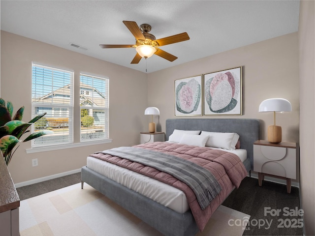 bedroom featuring carpet flooring, baseboards, visible vents, and ceiling fan