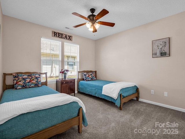 bedroom with visible vents, baseboards, carpet floors, a textured ceiling, and a ceiling fan