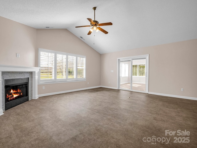 unfurnished living room featuring visible vents, a textured ceiling, a fireplace, baseboards, and ceiling fan