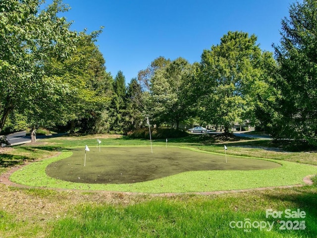 view of home's community with a lawn