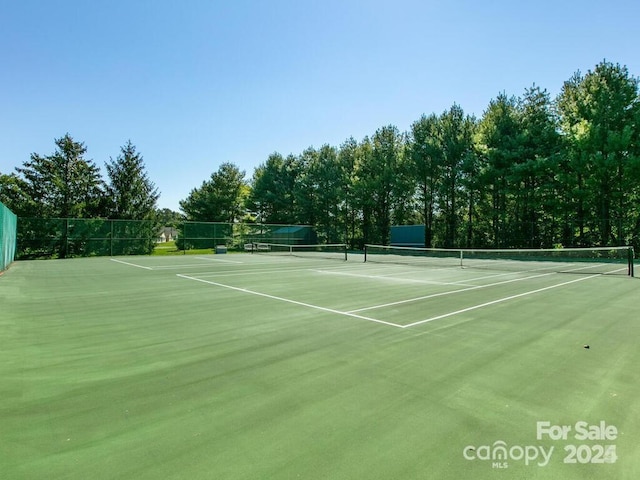 view of sport court with community basketball court and fence