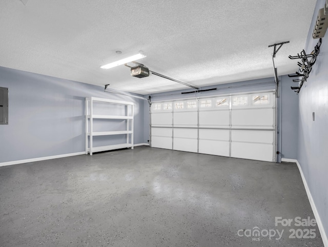 garage featuring electric panel, a garage door opener, and baseboards