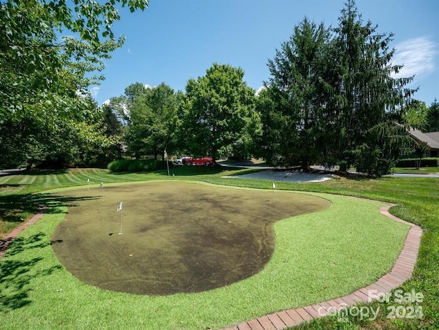 view of home's community featuring a lawn