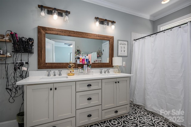 bathroom featuring a sink, a shower with shower curtain, ornamental molding, and double vanity