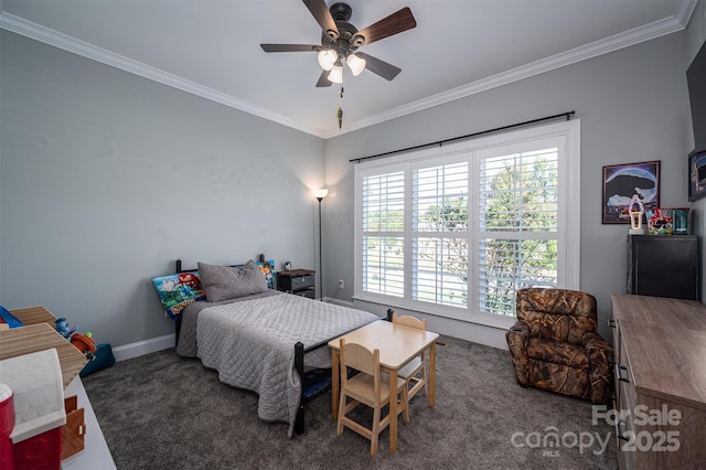 carpeted bedroom with baseboards, ornamental molding, and a ceiling fan