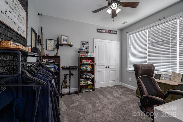 office area featuring visible vents, baseboards, a ceiling fan, and carpet floors