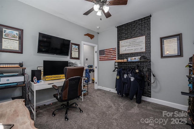 office area with ceiling fan and dark colored carpet