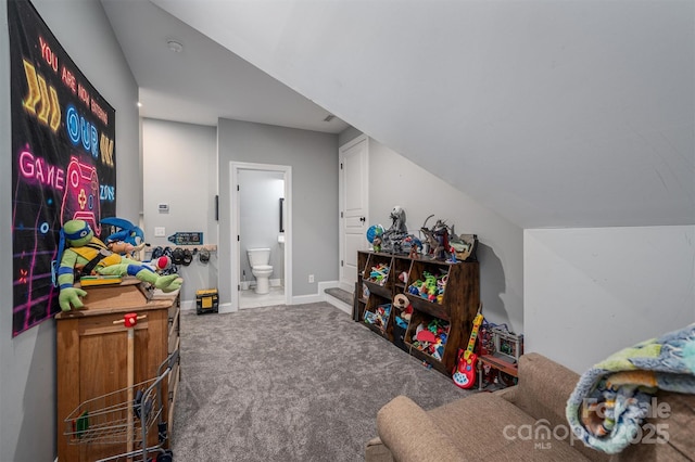 recreation room with baseboards, carpet flooring, and vaulted ceiling