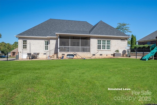 rear view of property with a patio, a sunroom, a lawn, and a playground