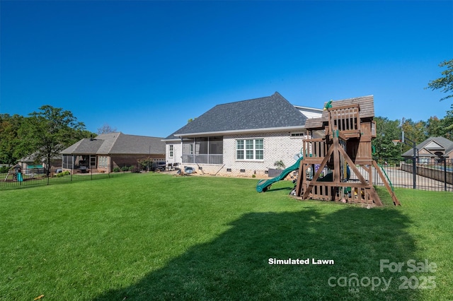 rear view of property featuring a shingled roof, a playground, fence, a lawn, and crawl space