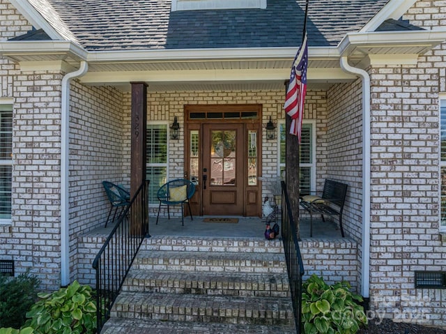 doorway to property with covered porch