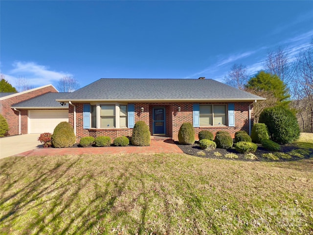 single story home featuring concrete driveway, roof with shingles, an attached garage, a front yard, and brick siding