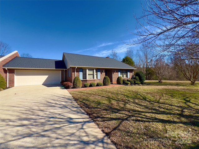 ranch-style house featuring a front lawn, brick siding, driveway, and an attached garage