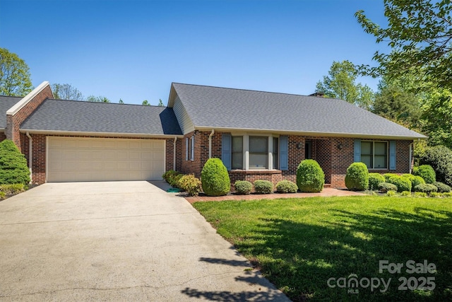 ranch-style home with a garage, a front yard, driveway, and brick siding