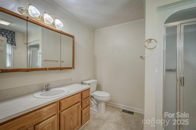 bathroom featuring vanity, a stall shower, toilet, and visible vents
