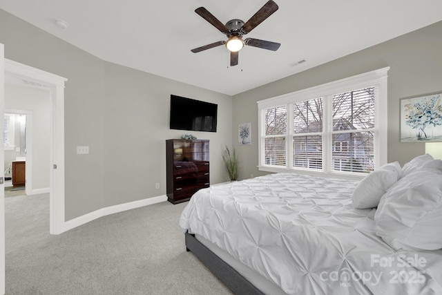 bedroom with ceiling fan, baseboards, light carpet, and visible vents