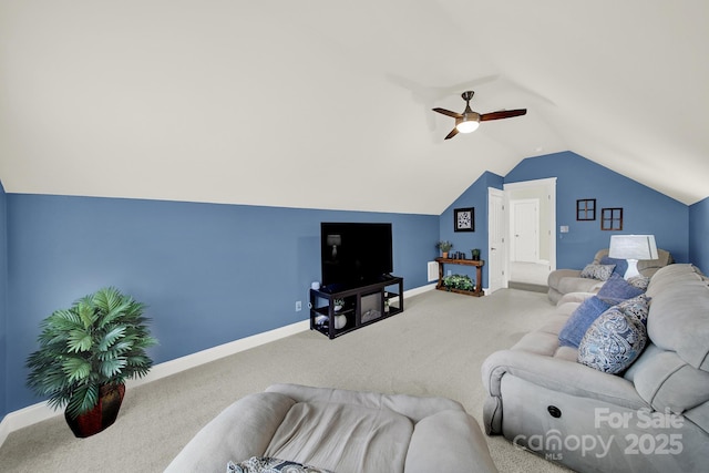 carpeted living room featuring baseboards, a ceiling fan, and lofted ceiling