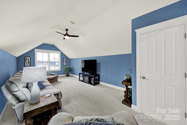 living area featuring vaulted ceiling, visible vents, carpet flooring, and baseboards