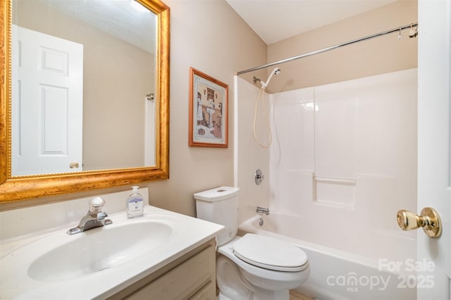 bathroom with toilet,  shower combination, and vanity