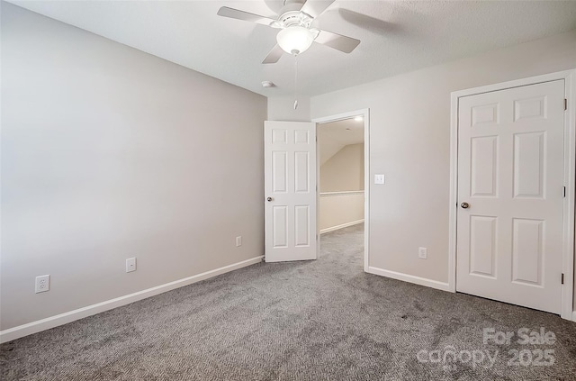 unfurnished bedroom with ceiling fan, carpet floors, and baseboards