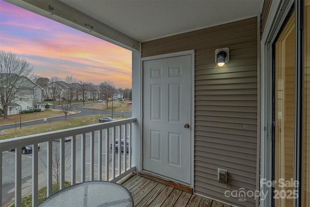 view of balcony at dusk