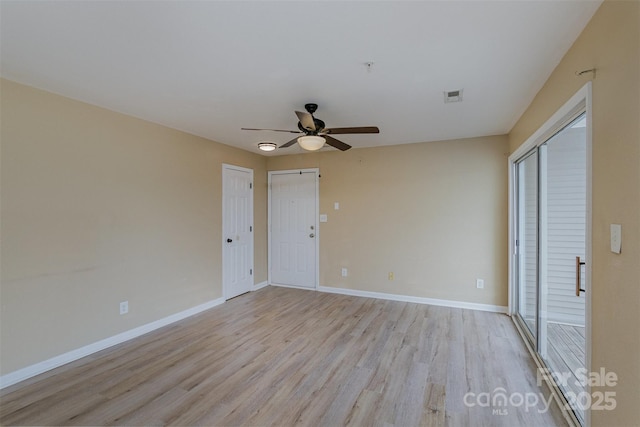 empty room featuring ceiling fan, two closets, and light hardwood / wood-style floors