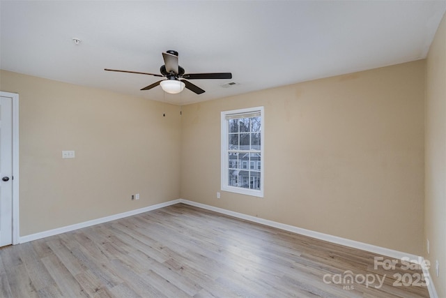 spare room with ceiling fan and light hardwood / wood-style flooring