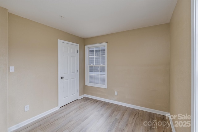 spare room with light hardwood / wood-style floors