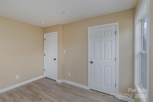 unfurnished bedroom featuring light hardwood / wood-style flooring