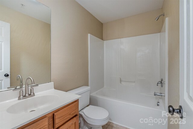 full bathroom featuring vanity,  shower combination, and toilet