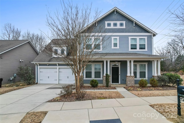 craftsman inspired home with a porch and a garage