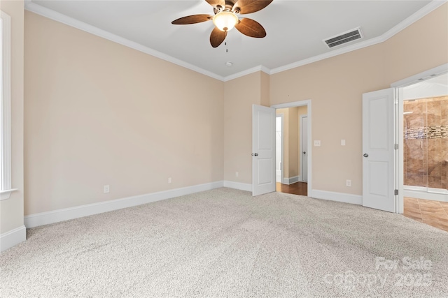 unfurnished bedroom with ornamental molding, carpet flooring, and ceiling fan