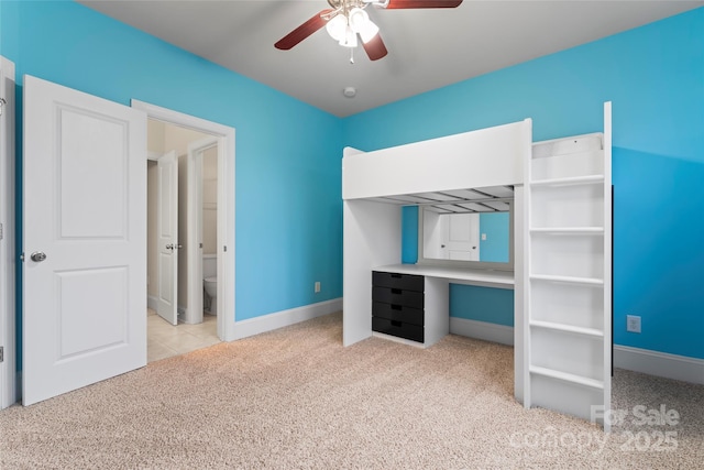 unfurnished bedroom featuring ceiling fan and light colored carpet