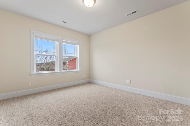 empty room featuring carpet floors