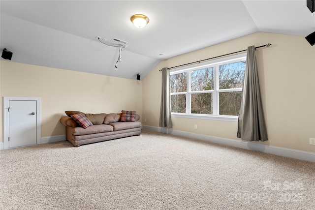 interior space with lofted ceiling and carpet floors