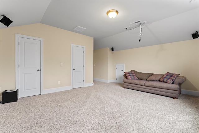 interior space with lofted ceiling and carpet floors