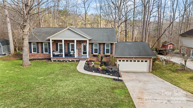 ranch-style house featuring a porch, a garage, and a front lawn