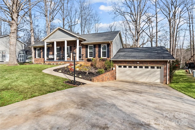 view of front of home with a porch, a garage, and a front yard