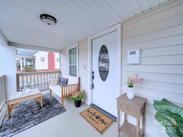 doorway to property with a porch