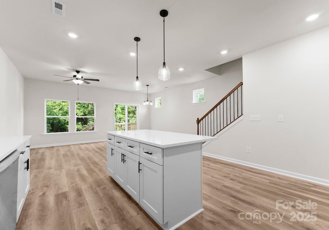 2825 New Pineola Rd Unit 7A, Charlotte, NC 28208 - kitchen with ceiling fan, light wood-style floors, light countertops, and visible vents