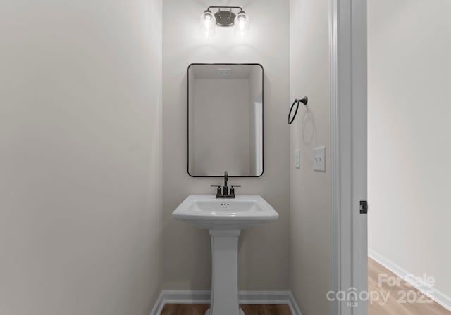 2825 New Pineola Rd Unit 7A, Charlotte, NC 28208 - bathroom with baseboards and wood finished floors