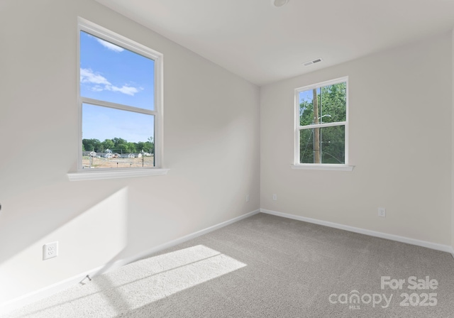 2825 New Pineola Rd Unit 7A, Charlotte, NC 28208 - unfurnished room featuring baseboards, visible vents, and carpet floors