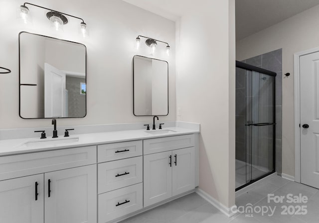 2825 New Pineola Rd Unit 7A, Charlotte, NC 28208 - bathroom featuring double vanity, tile patterned flooring, a stall shower, and a sink