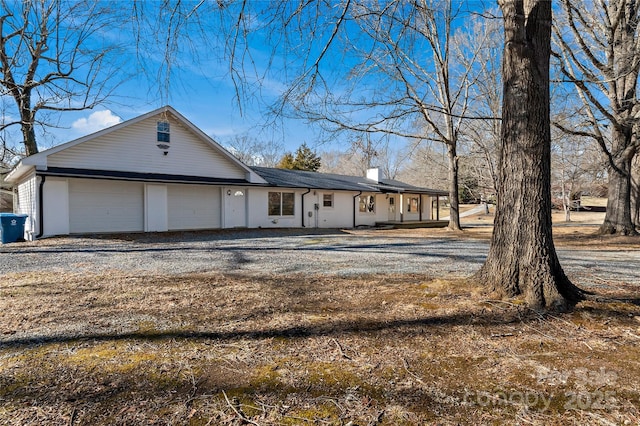 ranch-style home with a garage